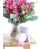 pink daisies with teddy bear for birth
