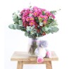 Bouquet of pink daisies with teddy bear
