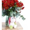 Detail of bouquet of red daisies and stuffed animal